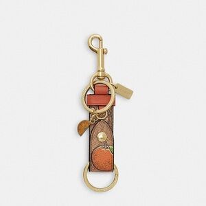 Coach Trigger Snap Bag Charm In Signature Canvas With Orange Print NWT